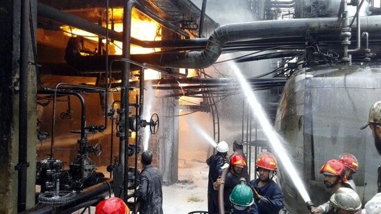 Firefighters try to put out a fire in main Homs refinery, Syria.(Reuters)