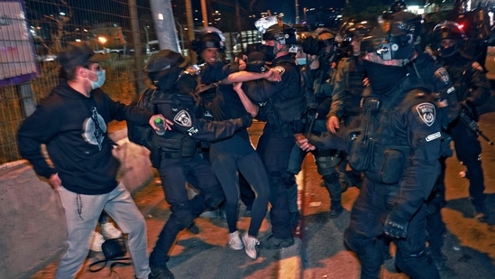 Israeli policemen clash with demonstrators protesting a possible eviction of local Palestinian families as part of an ongoing effort by Jewish Israelis to take control of homes in the Sheikh Jarrah neighbourhood of the Israeli-annexed east Jerusalem, (AFP) Israeli policemen clash with demonstrators protesting a possible eviction of local Palestinian families as part of an ongoing effort by Jewish Israelis to take control of homes in the Sheikh Jarrah neighbourhood of the Israeli-annexed east Jerusalem, (AFP)