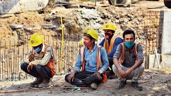 Migrant workers at a construction site at Pragati Maidan. (HT Photo ) Migrant workers at a construction site at Pragati Maidan. (HT Photo )