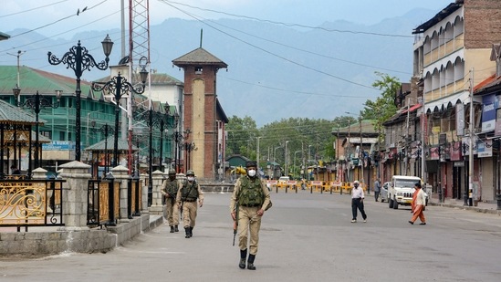 Security personnel patrol on a deserted street during Covid-induced curfew in Srinagar.(PTI file photo) Security personnel patrol on a deserted street during Covid-induced curfew in Srinagar.(PTI file photo)