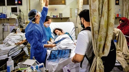 Doctors attend to a Covid-19 patient at the Holy Family Hospital in New Delhi.(Reuters)