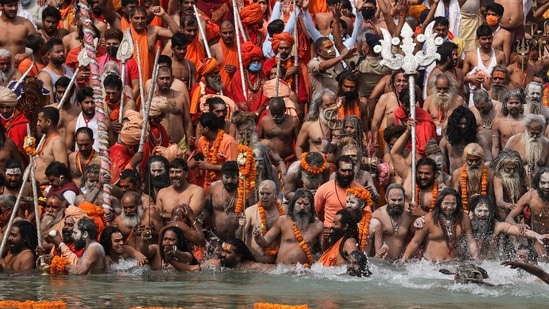 Men take holy dips in the Ganges River during Kumbh Mela in Haridwar, Uttarakhand, India, Monday, April 12, 2021. (AP)