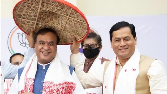 Bharatiya Janata Party (BJP) leader Himanta Biswa Sarma who is set to be the next chief minister of Assam is greeted by outgoing chief minister Sarbananda Sonowal in Guwahati on Sunday. (PTI PHOTO.) Bharatiya Janata Party (BJP) leader Himanta Biswa Sarma who is set to be the next chief minister of Assam is greeted by outgoing chief minister Sarbananda Sonowal in Guwahati on Sunday. (PTI PHOTO.)