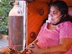 A Covid-19 patient breathes with oxygen support during a community service drive by Gurdwara Damdama Sahib in New Delhi on May 6. Delhi recorded 13,336 new Covid-19 cases on May 9, the fewest in a day since April 12, as the test positivity rate also continued its steady drop, falling to 21.67%, the lowest since April 16.(Ajay Aggarwal / HT Photo)