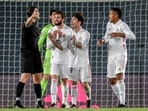 Real Madrid players argue with the referee during the Spanish La Liga soccer match between Real Madrid and Sevilla.(AP) Real Madrid players argue with the referee during the Spanish La Liga soccer match between Real Madrid and Sevilla.(AP)