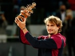 Germany's Alexander Zverev celebrates with the trophy after winning the Madrid Open.