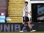 Manchester United's Harry Maguire leaves the pitch after sustaining an injury
