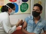 A health worker vaccinating a man against Covid-19, at Government Primary Health Center Bani Park, in Jaipur, Rajasthan. 