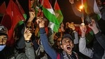 Protesters hold Palestine and Turkish national flags and chant slogans during a demonstration against Israel in front of the Israeli Consulate in Istanbul.(AFP) Protesters hold Palestine and Turkish national flags and chant slogans during a demonstration against Israel in front of the Israeli Consulate in Istanbul.(AFP)