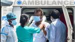A medic helps a Covid-19 patient wear a surgical mask on his face after getting off an ambulance, in Kolkata. (File photo) A medic helps a Covid-19 patient wear a surgical mask on his face after getting off an ambulance, in Kolkata. (File photo)