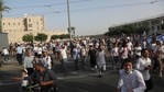 Israelis run to shelters as air attack sirens goes off during a Jerusalem Day march, in Jerusalem.(AP) Israelis run to shelters as air attack sirens goes off during a Jerusalem Day march, in Jerusalem.(AP)