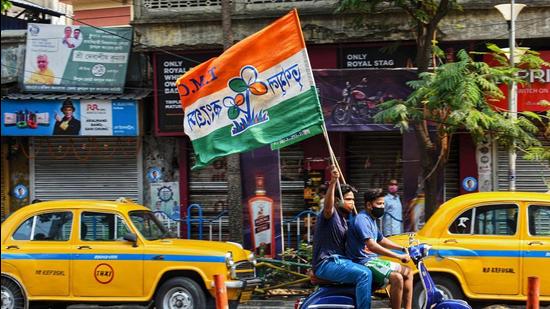 TMC supporters celebrate their party's lead in the West Bengal state legislative assembly elections on May 2. (File photo)