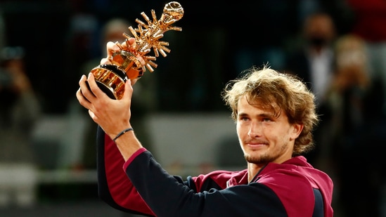 Germany's Alexander Zverev celebrates with the trophy after winning the Madrid Open.(REUTERS)