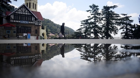 A pedestrian walks along a deserted Ridge during a curfew imposed to curb the spread of coronavirus disease, in Shimla, Himachal Pradesh, India, on Saturday, May 8, 2021. (Photo by Deepak Sansta / Hindustan Times)
