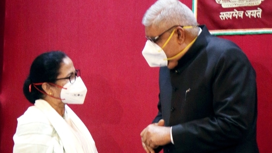 West Bengal Chief Minister Mamata Banerjee interacts with Governor Jagdeep Dhankar during the swearing-in ceremony of the new minister of the State, at the Raj Bhavan, in Kolkata on Monday. (ANI Photo) West Bengal Chief Minister Mamata Banerjee interacts with Governor Jagdeep Dhankar during the swearing-in ceremony of the new minister of the State, at the Raj Bhavan, in Kolkata on Monday. (ANI Photo)