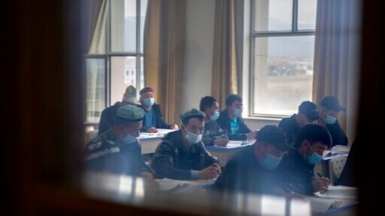 Uyghurs and other students attend a class at the Xinjiang Islamic Institute, as seen during a government organized visit for foreign journalists, in Urumqi in western China's Xinjiang Uyghur Autonomous Region. (AP) Uyghurs and other students attend a class at the Xinjiang Islamic Institute, as seen during a government organized visit for foreign journalists, in Urumqi in western China's Xinjiang Uyghur Autonomous Region. (AP)