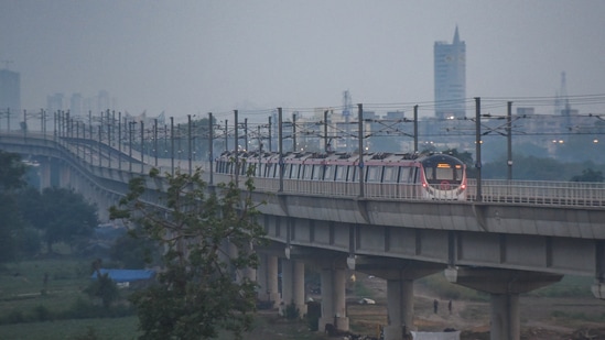 A DMRC metro train moves through Mayur Vihar in New Delhi on May 9. Metro rail services have been completely suspended for seven days starting May 10 and wedding ceremonies banned as well in public areas, HT reported.(Amal KS / HT Photo)