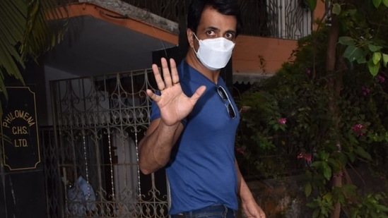 Sonu Sood waves to the paparazzi.