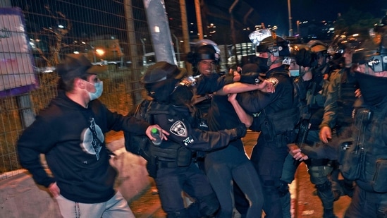 Israeli policemen clash with demonstrators protesting a possible eviction of local Palestinian families as part of an ongoing effort by Jewish Israelis to take control of homes in the Sheikh Jarrah neighbourhood in east Jerusalem, Israeli policemen clash with demonstrators protesting a possible eviction of local Palestinian families as part of an ongoing effort by Jewish Israelis to take control of homes in the Sheikh Jarrah neighbourhood in east Jerusalem,