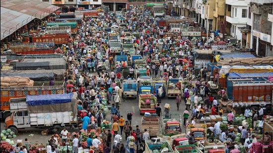 Heavy rush at a wholesale vegetable and fruit market during curfew relaxation in Jammu on Monday. (PTI) Heavy rush at a wholesale vegetable and fruit market during curfew relaxation in Jammu on Monday. (PTI)