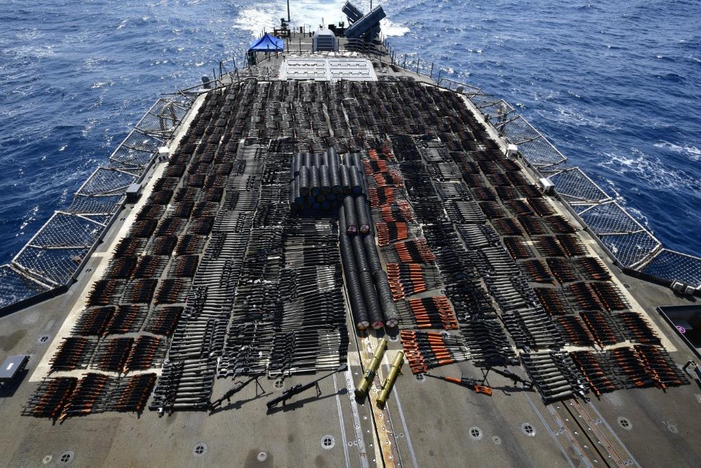 US Navy massive arms haul covered rear deck of 567-foot warship. All ...