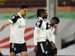 Fulham's Aleksandar Mitrovic and teammates look dejected after being relegated from the Premier League 