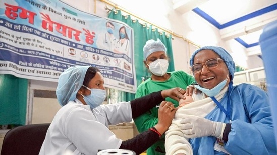 A medic administers Covid vaccine to a frontline worker. (File photo) A medic administers Covid vaccine to a frontline worker. (File photo)