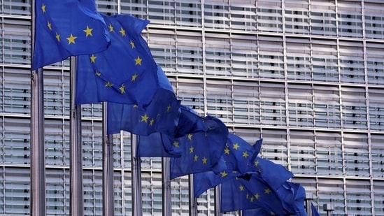 European Union flags fly outside the European Commission headquarters in Brussels, Belgium.(Reuters)