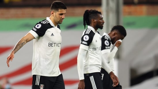 Fulham's Aleksandar Mitrovic and teammates look dejected after being relegated from the Premier League (REUTERS)