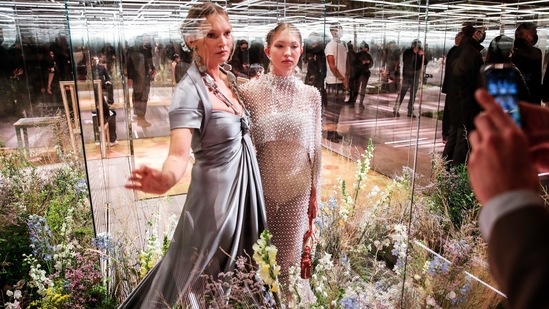 FILE - In this Jan. 27, 2021 file photo, model Kate Moss, left, and her daughter Lila Grace Moss wear a creation for Fendi's Spring-Summer 2021 Haute Couture fashion collection presented in Paris. The pandemic has torn a multibillion-dollar bite out of the fabric of Europe's luxury industry, stopped runway shows and forced brands to show their designs digitally instead. Now, amid hopes of a return to near-normality by the year’s end, the industry is asking what fashion will look like as it dusts itself and struggles to its well-heeled feet again.(AP)