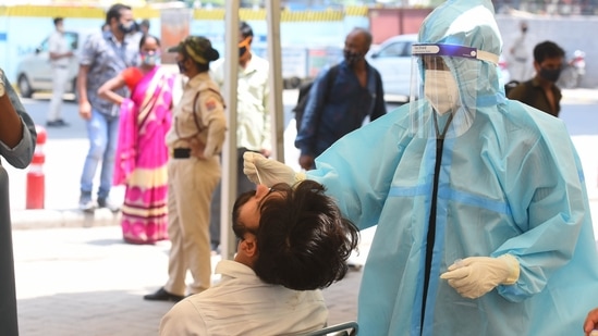 People being tested for Covid-19 during a random testing drive at Anand Vihar Bus Terminal, in New Delhi.