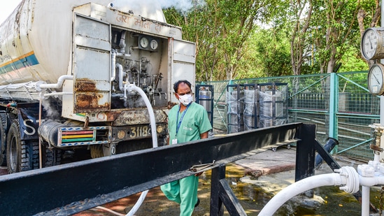 An oxygen tanker supplies medical oxygen to a private hospital, amid shortage of the gas due to rise in coronavirus cases, in New Delhi on May 10. The Delhi government on May 10 also allocated 990 ventilators to 15 hospitals and makeshift health care facilities in order to ramp up ICU beds in the city. Currently, there are 5,872 ICU beds, 98.9% of which were occupied.(Kamal Kishore / PTI)