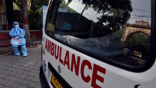 A relative of a Covid-19 victim waits outside Nigambodh Ghat crematorium in New Delhi on May 10. Delhi’s test positivity rate reached a peak of 36.2% on April 22, and stayed above 30% for eight more days before starting to decline. In the May 10 bulletin, it dipped below the 20% mark for the first time in over three weeks and stood at 17.76% a day later on May 11.(Sanjeev Verma / HT Photo)