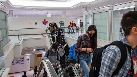 Students from the new Downtown Burlington High School use the building's escalators to get between floors and classes at a closed Macy's department store in Burlington, Vermont.(AFP) Students from the new Downtown Burlington High School use the building's escalators to get between floors and classes at a closed Macy's department store in Burlington, Vermont.(AFP)