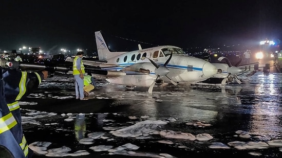 Emergency personnel work near a non-scheduled Beechcraft VT-JIL aircraft en-route from Nagpur to Hyderabad after an emergency belly-landing at the CSMIA, in Mumbai. (AFP) Emergency personnel work near a non-scheduled Beechcraft VT-JIL aircraft en-route from Nagpur to Hyderabad after an emergency belly-landing at the CSMIA, in Mumbai. (AFP)