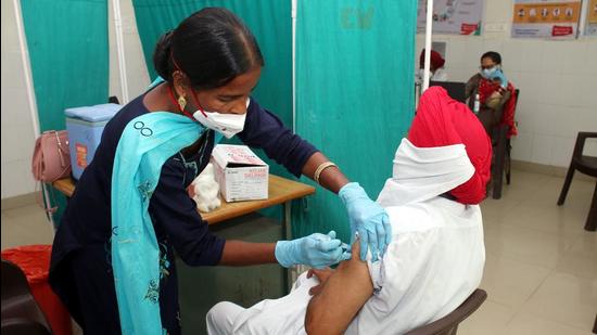 A person being vaccinated against Covid in Punjab on Tuesday. (Sanjeev Kumar/HT) A person being vaccinated against Covid in Punjab on Tuesday. (Sanjeev Kumar/HT)