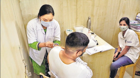 Vaccination at the Janata Vasahat on Sunday. Shortage of vaccine stock has made getting a slot for the jab difficult. (RAHUL RAUT/HT) Vaccination at the Janata Vasahat on Sunday. Shortage of vaccine stock has made getting a slot for the jab difficult. (RAHUL RAUT/HT)