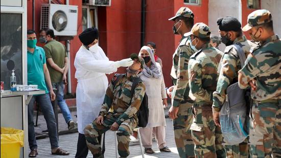 Jammu: A health worker takes samples from Army soldiers for COVID-19 tests, at a hospital in Jammu, Saturday, April 10, 2021. (PTI Photo) (PTI04_10_2021_000058B) (PTI) Jammu: A health worker takes samples from Army soldiers for COVID-19 tests, at a hospital in Jammu, Saturday, April 10, 2021. (PTI Photo) (PTI04_10_2021_000058B) (PTI)