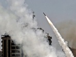 Rockets are fired from Gaza City, controlled by the Palestinian Hamas movement, towards Israel on May 11, 2021. (AFP) Rockets are fired from Gaza City, controlled by the Palestinian Hamas movement, towards Israel on May 11, 2021. (AFP)