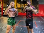 Irish MMCA fighter Conor McGregor (L) with ndian heavyweight fighter Ramston Edwin Rodrigues (R)