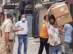 Police personnel during a raid at Khan Chacha restaurant in New delhi, in which boxes of oxygen concentrators were recovered.(PTI File Photo) Police personnel during a raid at Khan Chacha restaurant in New delhi, in which boxes of oxygen concentrators were recovered.(PTI File Photo)