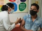 A health worker vaccinating a man against Covid-19, at Government Primary Health Center Bani Park, in Jaipur, Rajasthan.