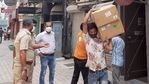 Police personnel during a raid at Khan Chacha restaurant in New delhi, in which boxes of oxygen concentrators were recovered.(PTI File Photo) Police personnel during a raid at Khan Chacha restaurant in New delhi, in which boxes of oxygen concentrators were recovered.(PTI File Photo)