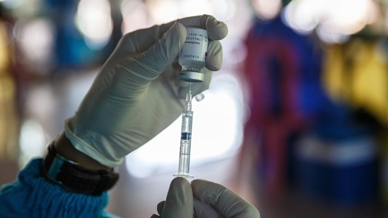 A healthcare worker fills a syringe with a dose of the AstraZeneca Covid-19 vaccine. (Bloomberg) A healthcare worker fills a syringe with a dose of the AstraZeneca Covid-19 vaccine. (Bloomberg)