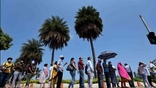 Beneficiaries wait in a queue outside BKC Jumbo Covid-19 vaccination centre to get vaccinated, in Mumbai on Tuesday, May 11. (Satish Bate/HT photo) Beneficiaries wait in a queue outside BKC Jumbo Covid-19 vaccination centre to get vaccinated, in Mumbai on Tuesday, May 11. (Satish Bate/HT photo)