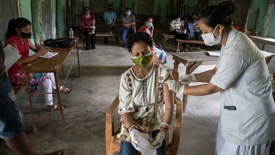 An Indian woman is injected with a dose of COVAXIN as she gets vaccinated against the coronavirus in Gauhati, Assam.(AP)