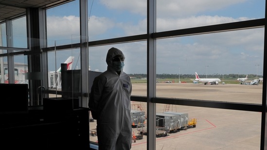 A Sri Lankan airport worker in protective suit stands inside a terminal at the Katunayake International Airport in Colombo, Sri Lanka. (AP) A Sri Lankan airport worker in protective suit stands inside a terminal at the Katunayake International Airport in Colombo, Sri Lanka. (AP)