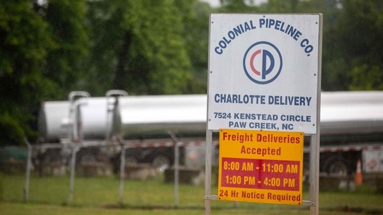 Tanker trucks can be seen in an adjacent lot next to the entrance of the Colonial Pipeline tank farm in Charlotte, North Carolina. (AFP) Tanker trucks can be seen in an adjacent lot next to the entrance of the Colonial Pipeline tank farm in Charlotte, North Carolina. (AFP)