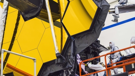 Webb's primary mirror is made of 18 hexagonal segments coated with an ultra-thin layer of gold to improve its reflection of infrared light. (Nasa) Webb's primary mirror is made of 18 hexagonal segments coated with an ultra-thin layer of gold to improve its reflection of infrared light. (Nasa)