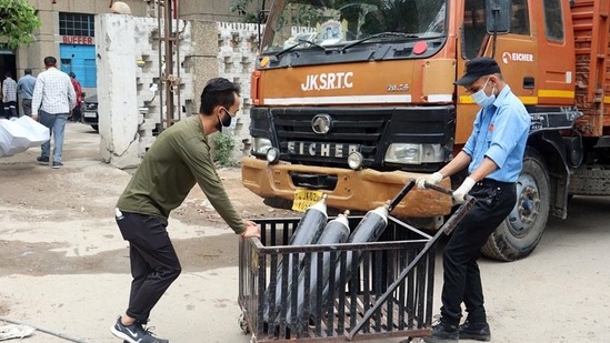 Workers at an Oxygen refill plant at Government Medical College Hospital in Jammu. (ANI) Workers at an Oxygen refill plant at Government Medical College Hospital in Jammu. (ANI)